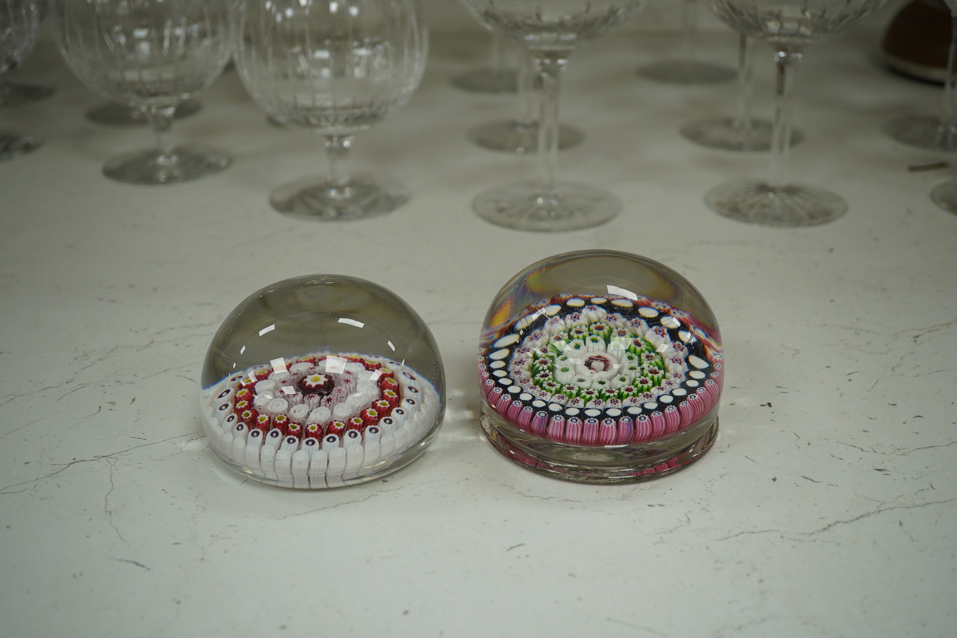 Two Victorian English millefiori glass paperweights, 7cm tall. Condition - fair to good